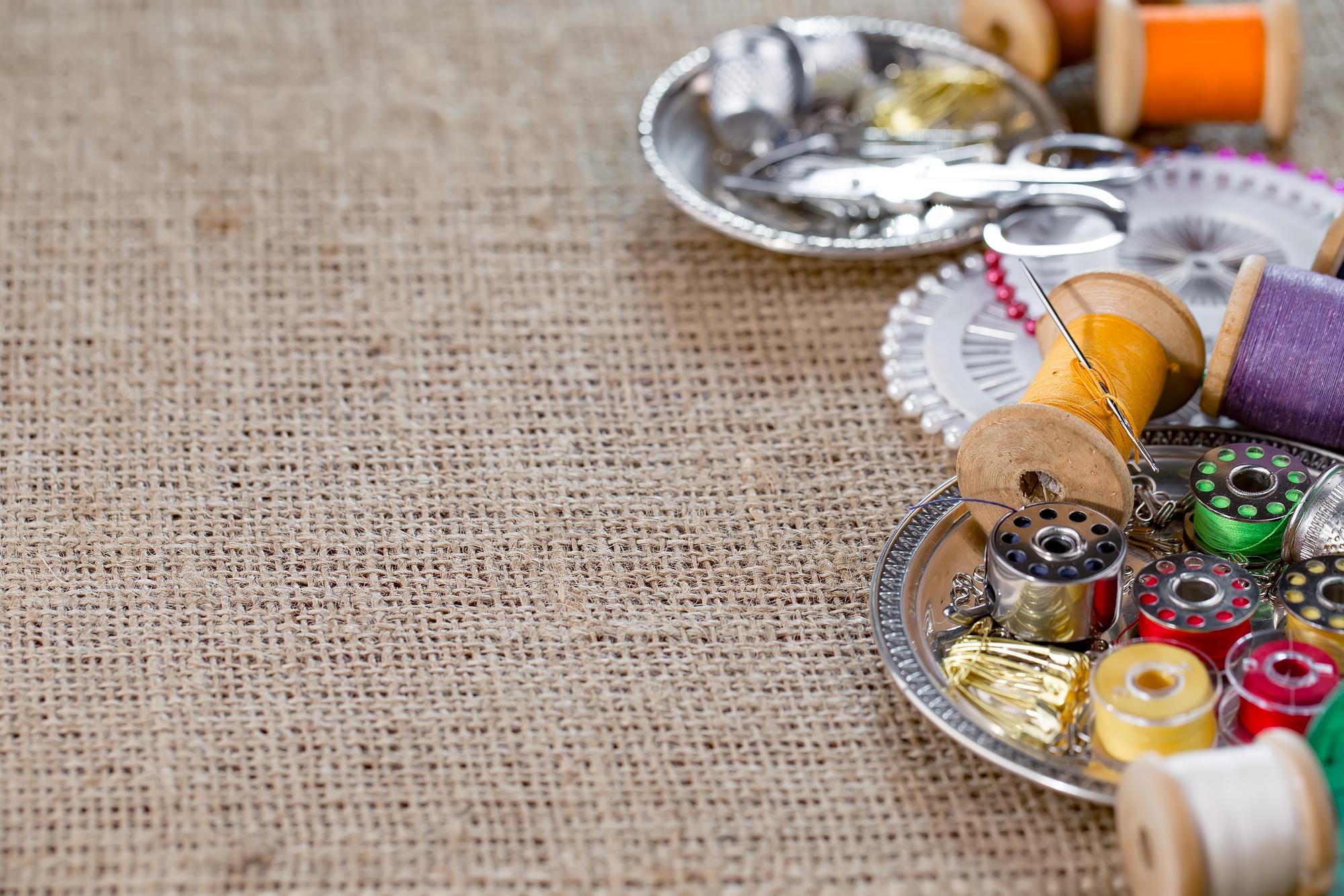 Workshop table with embroidered samples and tools